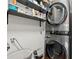Modern laundry room with stacked washer/dryer and overhead storage shelves at 3999 Brintons Ml, Marietta, GA 30062