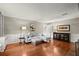 Comfortable living room with a light-blue sectional, hardwood floors, and large windows, perfect for relaxation and entertaining at 3999 Brintons Ml, Marietta, GA 30062