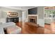 Inviting living room with hardwood floors, fireplace, and access to the sunroom at 3999 Brintons Ml, Marietta, GA 30062
