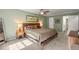 Spacious main bedroom featuring a comfortable bed, ceiling fan, and large windows with views of the outdoors at 3999 Brintons Ml, Marietta, GA 30062