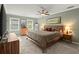 Spacious main bedroom with a ceiling fan, neutral carpet, and green walls at 3999 Brintons Ml, Marietta, GA 30062