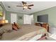 Relaxing main bedroom featuring a comfortable bed, ceiling fan, and a flat-screen television for restful nights at 3999 Brintons Ml, Marietta, GA 30062