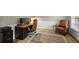 Stylish home office with rich wood desk, leather chair, and a neutral patterned rug at 3999 Brintons Ml, Marietta, GA 30062