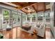 Bright sun room with hardwood floors, wood ceiling and beams, and lots of windows at 3999 Brintons Ml, Marietta, GA 30062
