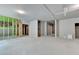 Large unfinished basement with concrete floors, exposed studs, and utility hookups at 7760 Hansel Ln, Lithonia, GA 30058