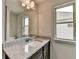 Bathroom vanity featuring gray granite and ample natural light at 7760 Hansel Ln, Lithonia, GA 30058