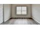 Cozy bedroom with wood-look flooring and a sunny window at 7760 Hansel Ln, Lithonia, GA 30058