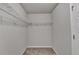 Walk-in closet featuring wire shelving and carpeted floor at 7760 Hansel Ln, Lithonia, GA 30058