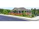 Community clubhouse with a large porch and wood ramp at 7760 Hansel Ln, Lithonia, GA 30058