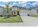 Charming two-story home features a covered front porch and attached two car garage at 7760 Hansel Ln, Lithonia, GA 30058