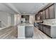 New kitchen with granite countertops, stainless appliances and an open floor plan to the living room and stairs at 7760 Hansel Ln, Lithonia, GA 30058