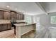 New kitchen with granite countertops, stainless appliances and an open floor plan to the backyard at 7760 Hansel Ln, Lithonia, GA 30058