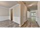 Open-concept living area boasts stylish wood flooring and modern wall accents at 7760 Hansel Ln, Lithonia, GA 30058