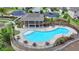 Aerial shot of the community pool and clubhouse, with lots of seating and a beautiful design, perfect for relaxation at 7760 Hansel Ln, Lithonia, GA 30058