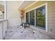 Charming patio with seating, umbrella, and serene view at 8650 Hope Mews Ct, Sandy Springs, GA 30350