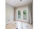 Balcony features french doors, neutral walls, and tile flooring at 8650 Hope Mews Ct, Sandy Springs, GA 30350