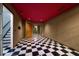 Finished basement with black and white tile flooring and red ceiling at 8650 Hope Mews Ct, Sandy Springs, GA 30350