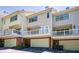 Exterior view of townhomes with attached garages and private balconies at 8650 Hope Mews Ct, Sandy Springs, GA 30350
