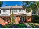 Charming brick townhome with a well-manicured lawn and inviting front porch at 8650 Hope Mews Ct, Sandy Springs, GA 30350