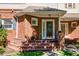 Close-up of a lovely brick front porch with a charming front door and well-maintained landscaping at 8650 Hope Mews Ct, Sandy Springs, GA 30350