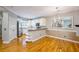 Modern kitchen featuring stainless steel appliances, white cabinets, and hardwood flooring at 8650 Hope Mews Ct, Sandy Springs, GA 30350