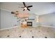 Bright living room featuring fireplace, marble flooring, and adjacent kitchen at 8650 Hope Mews Ct, Sandy Springs, GA 30350