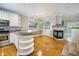 Open living area with hardwood floors, fireplace, and bar area at 8650 Hope Mews Ct, Sandy Springs, GA 30350