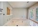 Inviting living room with a large window, french doors, and stylish tile flooring at 8650 Hope Mews Ct, Sandy Springs, GA 30350