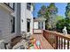 Back deck with outdoor seating area overlooking a beautiful landscape at 2123 Floral Ridge Dr, Dacula, GA 30019