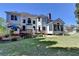 Expansive backyard featuring a deck, fountain, and lush green lawn at 2123 Floral Ridge Dr, Dacula, GA 30019