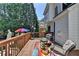 Spacious deck with outdoor seating and views of the landscaped backyard at 2123 Floral Ridge Dr, Dacula, GA 30019