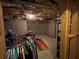 Unfinished basement corner with clothing rack and painted wall at 2123 Floral Ridge Dr, Dacula, GA 30019