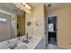 Double vanity bathroom with large mirror and bathtub/shower at 2123 Floral Ridge Dr, Dacula, GA 30019