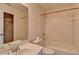 Bathroom with a shower and tub with white tile at 2123 Floral Ridge Dr, Dacula, GA 30019