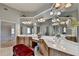 Large vanity and sink in primary bathroom featuring plenty of mirror space and natural light at 2123 Floral Ridge Dr, Dacula, GA 30019
