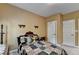 A comfortable bedroom with neutral walls and ample natural light from an unseen window at 2123 Floral Ridge Dr, Dacula, GA 30019