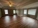 Bedroom featuring trey ceilings, neutral paint, hardwood floors, and abundant natural light at 2123 Floral Ridge Dr, Dacula, GA 30019