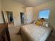 Cozy bedroom with soft lighting, neutral decor, and windows providing natural light at 2123 Floral Ridge Dr, Dacula, GA 30019