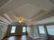 Spacious bedroom with trey ceilings, recessed lighting, and hardwood floors at 2123 Floral Ridge Dr, Dacula, GA 30019
