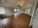 Spacious primary bedroom featuring hardwood floors, neutral paint, and trey ceilings at 2123 Floral Ridge Dr, Dacula, GA 30019
