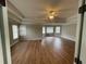 Empty primary bedroom featuring beautiful molding, hardwood floors and lots of natural light at 2123 Floral Ridge Dr, Dacula, GA 30019