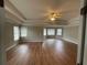 Large primary bedroom featuring trey ceilings, neutral paint, and hardwood floors at 2123 Floral Ridge Dr, Dacula, GA 30019