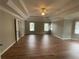 Spacious main bedroom with tray ceilings, and hardwood flooring at 2123 Floral Ridge Dr, Dacula, GA 30019