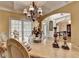 An elegant dining room featuring a stylish chandelier, an archway into the home and refined decor at 2123 Floral Ridge Dr, Dacula, GA 30019