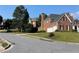 Beautiful two-story brick home featuring an attached garage, manicured landscaping and a chimney at 2123 Floral Ridge Dr, Dacula, GA 30019