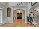 Spacious foyer featuring hardwood floors and an open layout with access to living areas and staircase at 2123 Floral Ridge Dr, Dacula, GA 30019
