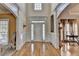 Elegant foyer featuring hardwood floors, arched doorways, decorative molding, and a grand entrance at 2123 Floral Ridge Dr, Dacula, GA 30019