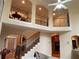 Open foyer with an overlooking balcony and a staircase leading upstairs at 2123 Floral Ridge Dr, Dacula, GA 30019