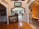 Elegant foyer boasts arched entryways, hardwood floors, and staircase access to other areas of the home at 2123 Floral Ridge Dr, Dacula, GA 30019