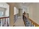 Hallway featuring decorative railings and arched entryways at 2123 Floral Ridge Dr, Dacula, GA 30019